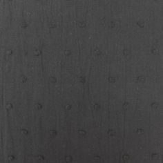 an image of black fabric with small dots on it