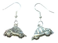 two silver earrings with a car on it's back and the word love written in white