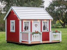 Kids looking through the windows of Kids Playhouse Nordic Nario by WholeWoodPlayhouses Playhouse Paint Ideas, Windows With Curtains, Wooden Outdoor Playhouse, Custom Playhouse, Outdoor Playhouses, Wood Playhouse, Loft Flooring, Backyard Playhouse, Wooden Terrace