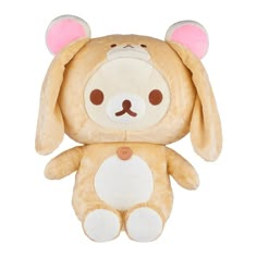 a brown stuffed animal with ears on it's head sitting next to a white background