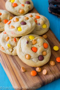 white chocolate chip cookies with candy corn on a cutting board