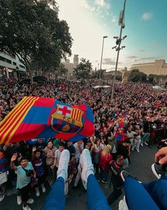 a large group of people standing in the street