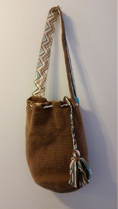 "Handcrafted Wayuu Mochila Bag  Woven, round bucket tote with tassels  Large enough to hold just about everything, but convenient to carry Bring to the beach, the farm, or around town Lined with patterned cotton; three storage pockets (one zippered) Machine wash in cold water; tumble dry low Measures around 14\" wide and 14\" high with a 32\" lined shoulder strap See my shop for more patterned mochila bags. Custom orders available." Zuma Paw Patrol, Skye Paw, Mochila Bag, Dance Themes, Puppet Patterns, Crochet Octopus, Brown Tote Bag, Crochet Shoulder Bag, Bucket Tote