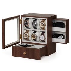 an open wooden watch box filled with watches