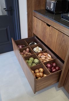 an open drawer with different types of food in it