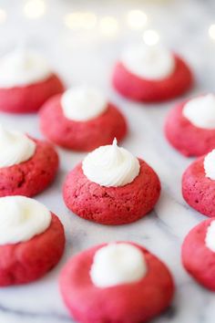 red velvet cookies with white frosting on top