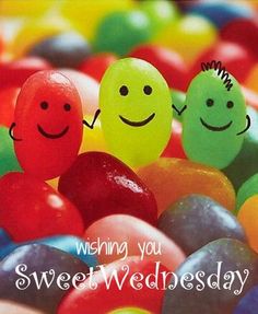 two candy candies with smiling faces on them and the words wishing you sweet wednesday