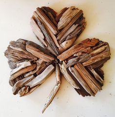 several pieces of driftwood arranged in the shape of a flower