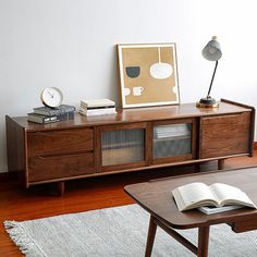 an open book is sitting on top of a coffee table