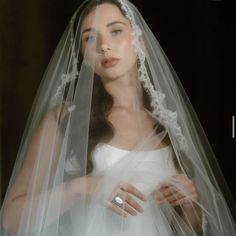 a woman in a wedding dress with a veil over her head and the words i do not know what this is