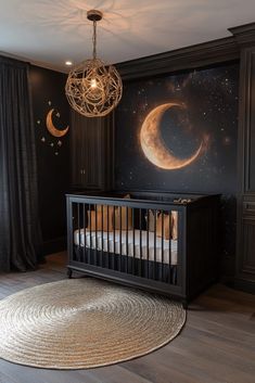 a baby's room with a crib, moon and stars painted on the wall