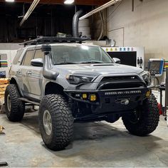 an off road vehicle parked in a garage