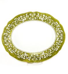 a green and white plate sitting on top of a table