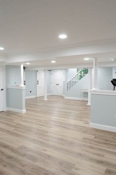 an empty room with hard wood flooring and white painted walls on the second floor