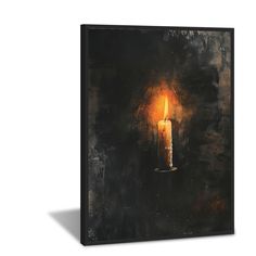 a lit candle on a black background