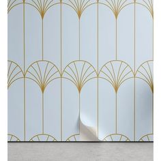 an art deco wallpaper with gold lines on it