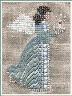 a cross stitch picture of a woman in blue dress