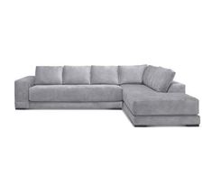 a gray sectional couch with pillows on it's back and one end facing the sofa