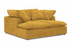 a yellow couch with pillows on it