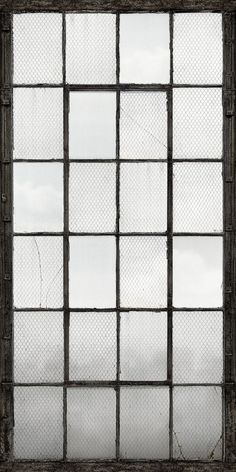 an old window with bars in the middle