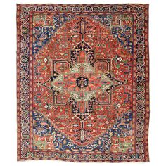 an orange, blue and red rug with ornate designs