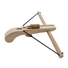 a wooden object with a cork holder attached to it's back end and an arrow in the middle