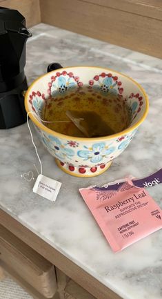 a bowl of soup sitting on top of a counter