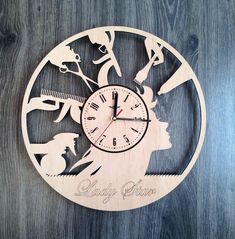 a wooden clock with the silhouettes of women and men on it's face