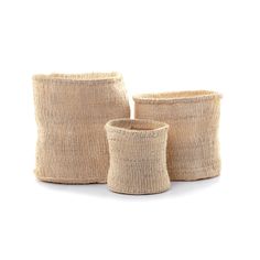 three jute baskets on white background