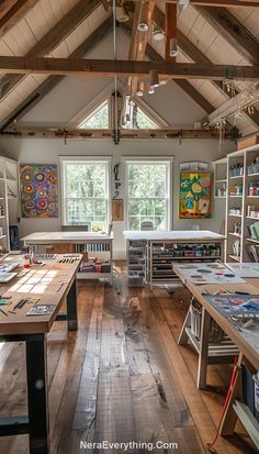 an artist's studio with wooden floors and vaulted ceiling