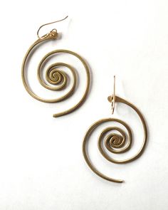 In these bronze or sterling silver plated earrings, the beauty of the universe intertwines with the artistry of the human hand. A crowd favorite, classic Lochlin Smith design. The larger sibling to our Spiral Galaxy Earrings. Length includes earwires. Earwires are 14/20 gold filled or sterling silver depending on color. Spiral Brass Hoop Earrings With Ear Wire, Spiral Brass Jewelry, Artistic Spiral Nickel-free Jewelry, Artistic Gold Spiral Jewelry, Unique Swirl Earrings As Gift, Unique Swirl Earrings For Gifts, Spiral Pierced Earrings As Gift, Adjustable Spiral Brass Earrings, Spiral Pierced Earrings For Gift