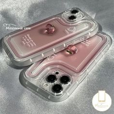 two clear cases with black and pink ear plugs in them on a silver surface