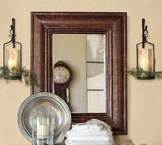 an image of a mirror and other items on the shelf in front of it,