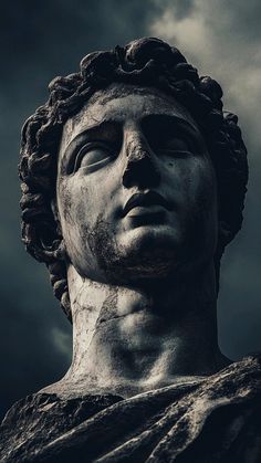 a statue is shown against a dark sky with clouds in the backgroung