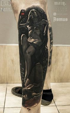 a man's leg with an artistic tattoo on it