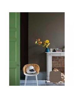 the salon drab no 29 is displayed in front of a green door and white table