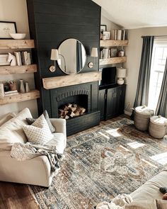 a living room filled with furniture and a large mirror on top of a fireplace mantel