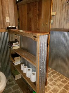 a toilet and some shelves in a room