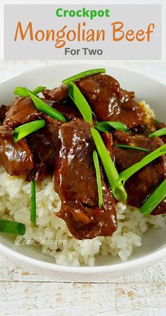 a white plate topped with meat and rice