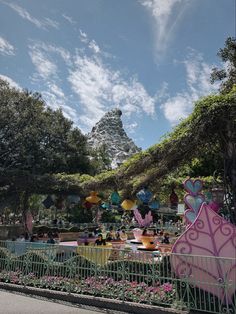 an amusement park with lots of rides and decorations