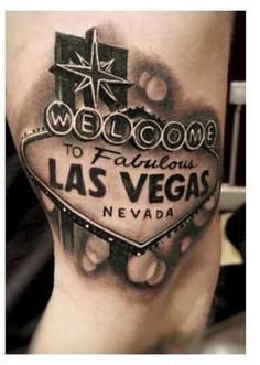 a black and white tattoo with the words welcome to fabulous las vegas nevada