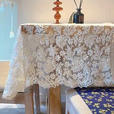 a white table cloth on top of a wooden bench