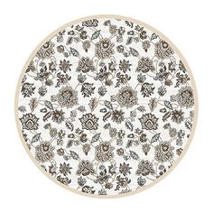 a white and brown plate with floral designs on the bottom, in front of a white background