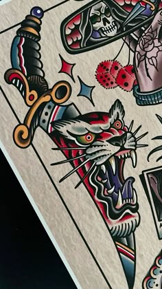 a close up of a playing card with tattoos on it