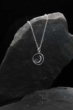 Moon necklace, Sterling Silver necklace, Moon pendant, Half-moon pendant, Minimalist necklace, Witch talisman, Practical magic This elegant moon necklace has been hand-made using 925 sterling silver.  I creat this pendant for amazing people who are in love with the Moon. The minimalist necklace would make a wonderful, personal gift! It's light, simple, and yet elegant, and it is beautifully made. Your order will be sent out with a gift box and if you're giving it as a gift I can include a person Cool Pendants For Men, Silver Moon Necklace With Coin Pendant, Sterling Silver Crescent Amulet Necklace, Silver Pendant Necklace Simple, Moon-shaped Amulet Necklaces For Gifts, Moon Shaped Amulet Necklaces As Gift, Silver Moon-shaped Amulet Necklace, Moon Shaped Amulet Necklace For Gift, Sterling Silver Moon Charm Amulet Necklace