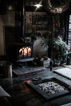 a living room filled with furniture and a fire place next to a large glass window