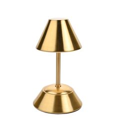 a gold table lamp on a white background with clippings to the top and bottom