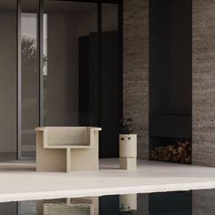 a white bench sitting on top of a swimming pool next to a tall glass wall