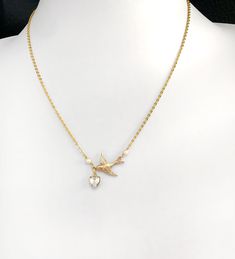 "This handmade necklace features a beautiful vintage swallow, old Japanese glass pearls and a vintage glass heart which could be Swarovski. It is finished with a high quality vintage gold plated chain. The pink opalescent version is listed separately. The last two photos show the necklace on a size 12 mannequin.  The necklace is not adjustable at 17\"= 43cm. They are made to order so please message me if you need a different length or an extender chain attached. The decorative part of the necklace measure 3cm across. It is safely gift-wrapped in a presentation box or pouch." Swallow Necklace, Lover Necklace, Pearl Necklace Vintage, Lovers Necklace, Necklace Heart, Bird Lover, Pearl Pendant Necklace, Glass Heart, Gold Chain Necklace