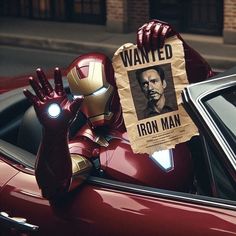 iron man holding up a wanted poster in the back of a car